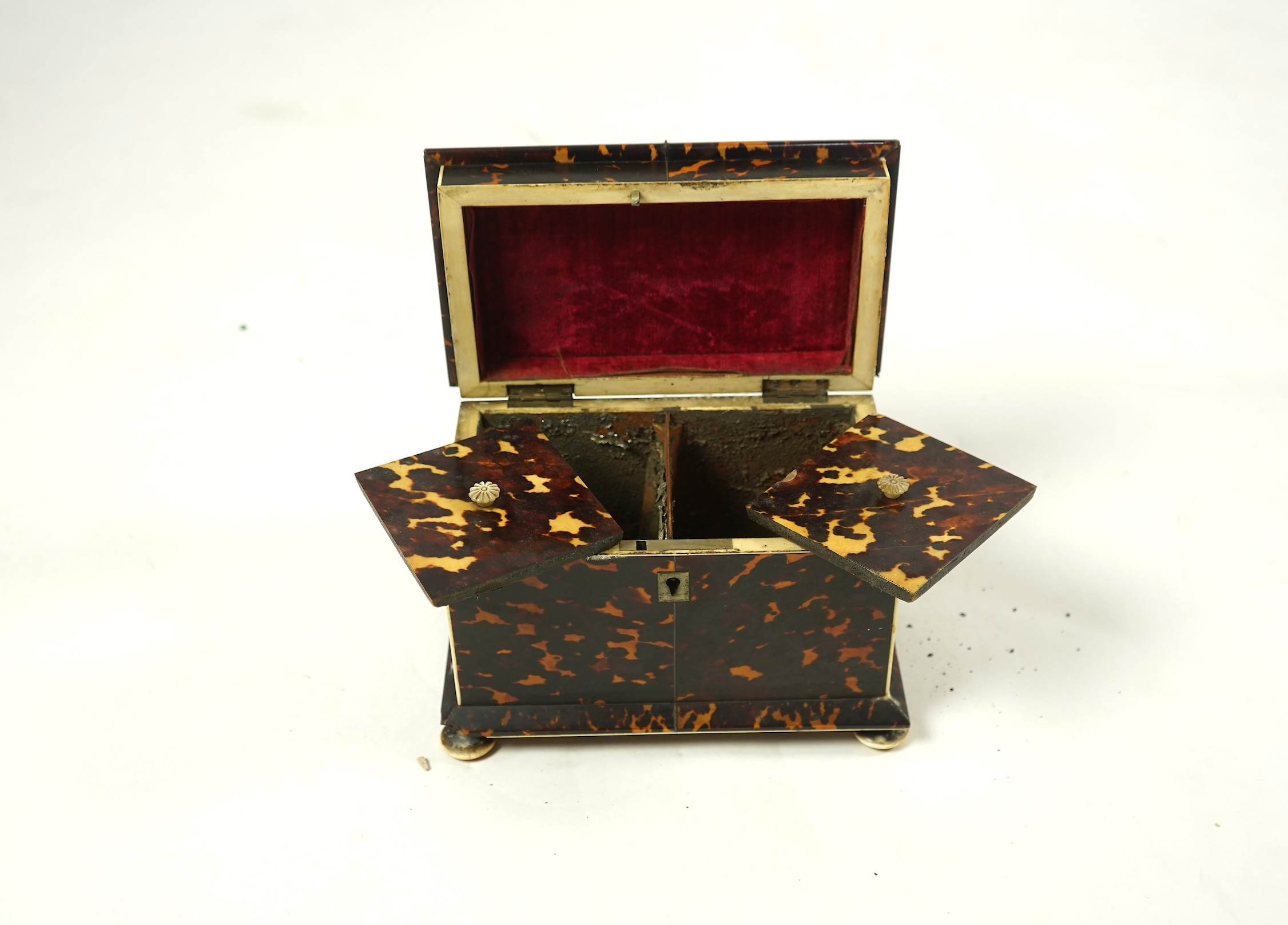 An early Victorian tortoiseshell tea caddy